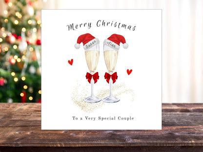 Personalised Champagne Christmas Card for Couple: Santa Hats